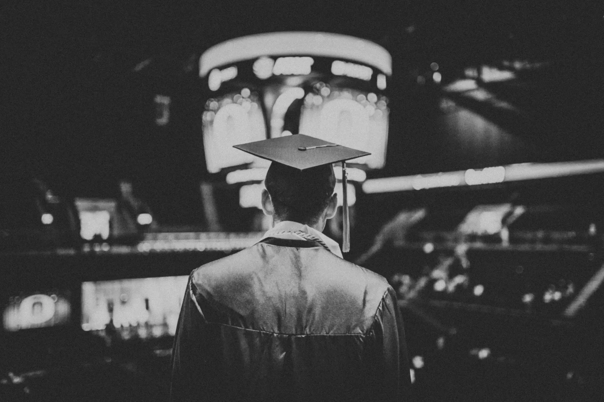 a graduated student wearing a square graduation hat and clothes, attending his school convo